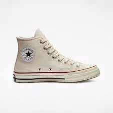 Side view of a classic high-top Converse Chuck Taylor All Star sneaker in off-white color